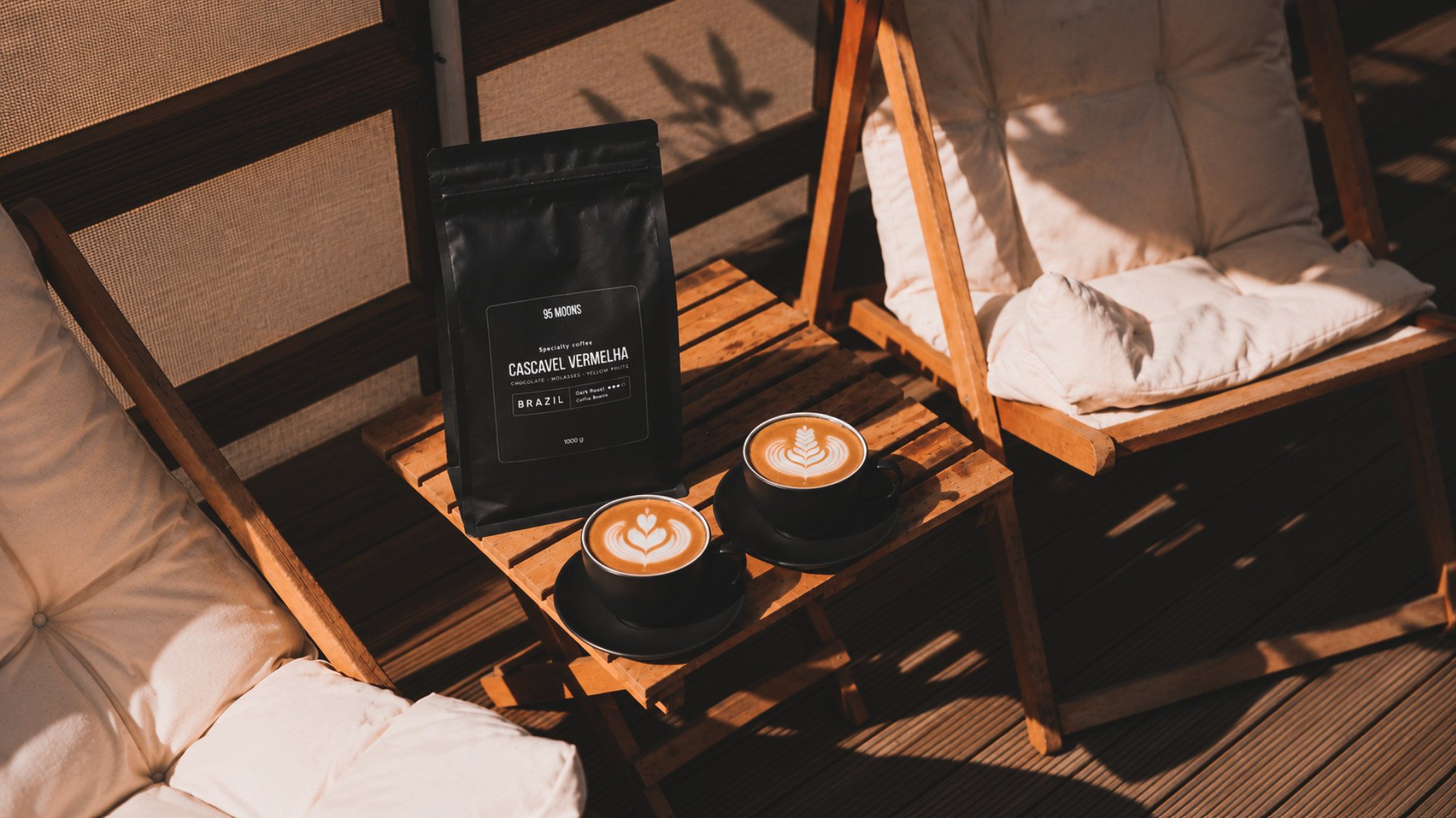 Coffee bag and two latte cups in terrace